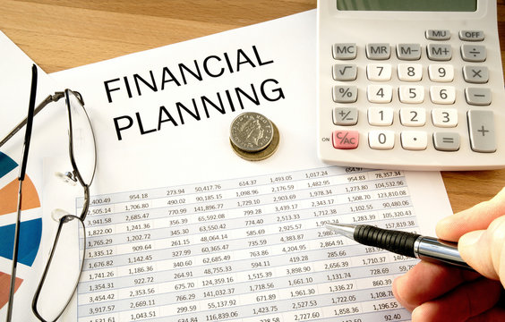 Financial planning with calculator and pen