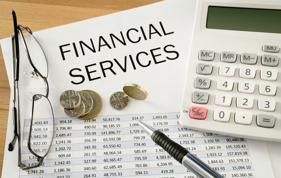Financial Services with money, pen and calculator