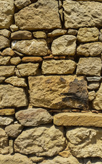 View of an old wall with yellow stones