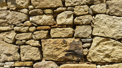 View of an old wall with yellow stones