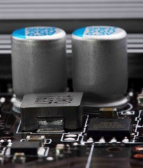transistors capacitors resistors and other electronic components mounted on motherboard(macro)...
