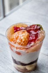 Mandarin and strawberry (mixed fruits) parfait with yogurt in gl