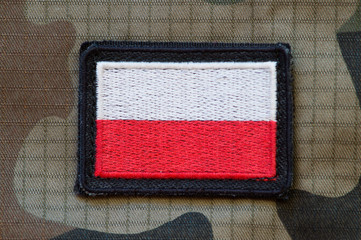 Polish flag on military uniform  close-up