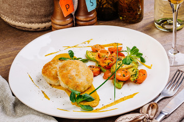 Chicken cutlets, grilled zucchini and fresh vegetable salad