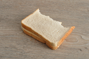 A sandwich with a bite taken out of it