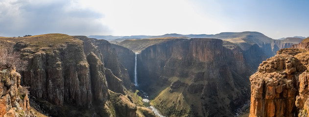 Panorama of the Maletsunyane Falls and large canyon in the mountainous highlands near Semonkong, Lesotho, Africa - obrazy, fototapety, plakaty