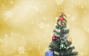 decorative with gift box and snowflake on christmas tree on abstract bokeh light background.