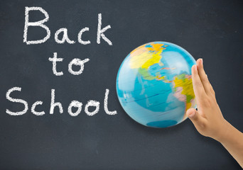 boy rotating the globe