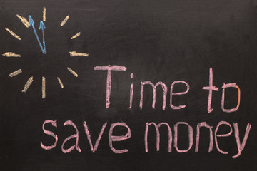 Obraz premium Time to save money - clock with text on black