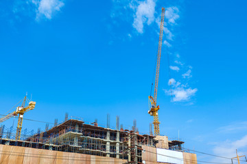 Naklejka premium building construction site with crane tower machinery