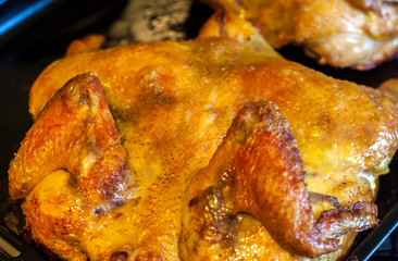 Roasted chicken on iron pan, food