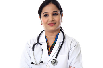 Smiling doctor woman against white background