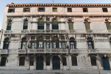 Naklejka premium Ancient house facade at sunset in Venice, Italy.