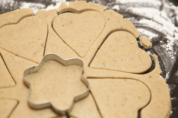 Cut the shape out of the dough for ginger cookies