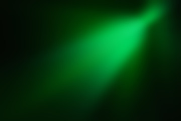 Bright green rays on a dark background