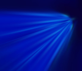 Bright blue rays of light on a dark background