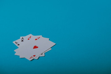 A winning poker hand of four aces playing cards
