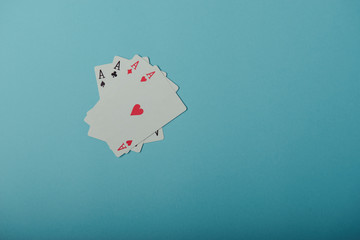 A winning poker hand of four aces playing cards
