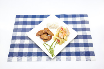 Thai salad with cucumber and spicy sausage and steam rice