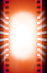 Cinema film strips and projector light rays.