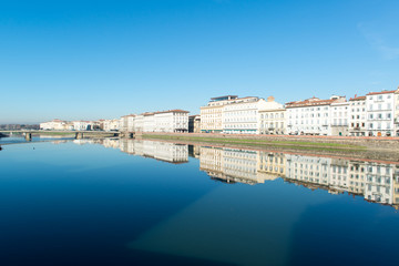 View of Arno river embankment with architecture and buildings re