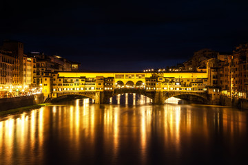 Fototapeta na wymiar The Ponte Vecchio illuminated at twilight