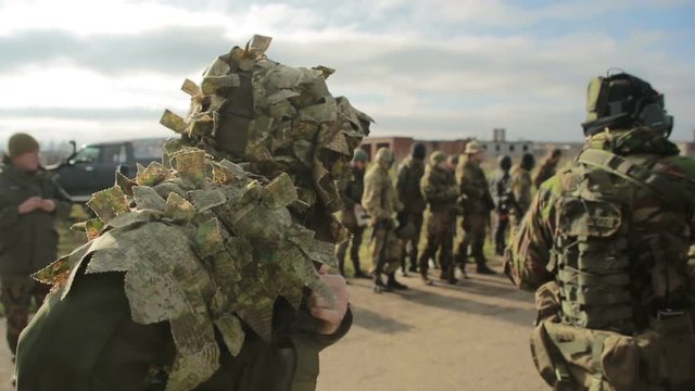 militias are fighting. Men in camouflage with guns and playing airsoft. war