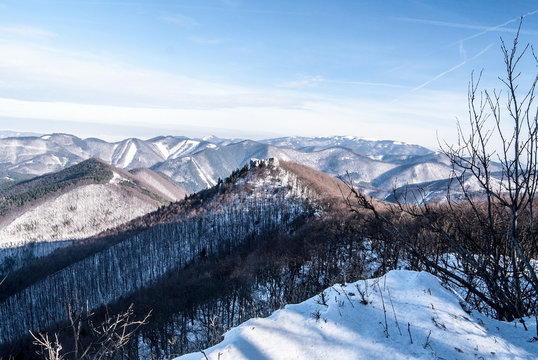 winter panorama of Lucanska Mala Fatra mountains with many hills, snow, no civilisation and clear sky from Rovna skala hill