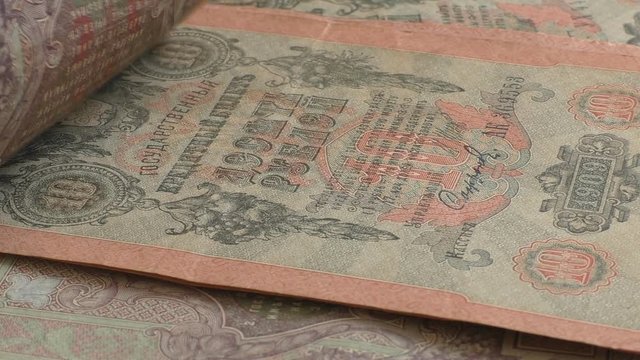 Old, more than 100 years not in use, big in size Russian Empire tzar era bank notes being counted 