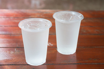 Glass of water on wooden table