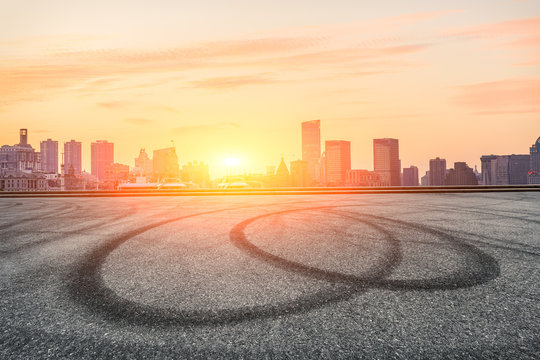 Asphalt Road And Modern Cityscape At Sunset In Shanghai