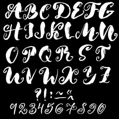 Hand drawn font made by dry brush strokes. Grunge style alphabet with swirl.