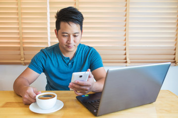 Young man working at home.