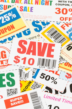 Saving coupon voucher with scissors, coupons are mock-up