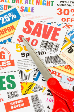 Saving discount coupon voucher with scissors, coupons are mock-u