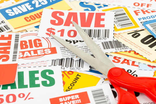 Saving discount coupon voucher with scissors, coupons are mock-u