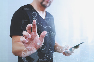 Businessman hand pressing an imaginary button,holding smart phon
