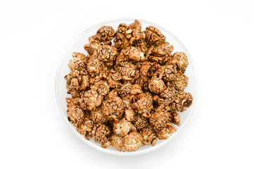 Top view of Homemade chocolate Popcorn in a glass Bowl and white