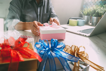 Creative choosing gift with laptop computer and smart phone on m