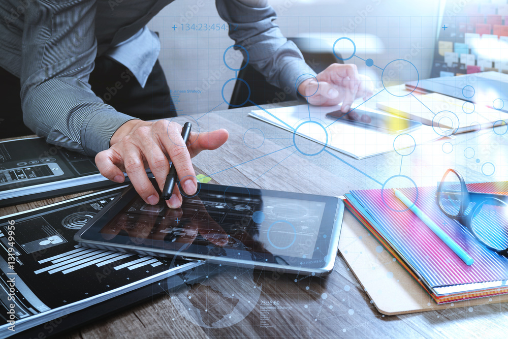 Aufkleber website designer holding smart phone and working computer digita