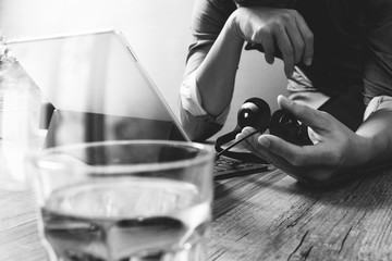 business man using VOIP headset with digital tablet computer doc