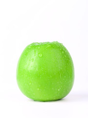 Juicy green apple isolated on white in studio - XXL file with selective focus.