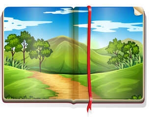 Book with mountain and forest scene