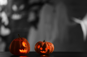 Scary Halloween pumpkins on blurred background