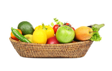 Fresh vegetables and fruits in basket on white background