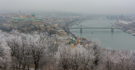 Castle and Chain Bridge view from Gellert Hill in a snowy december morning, Budapest