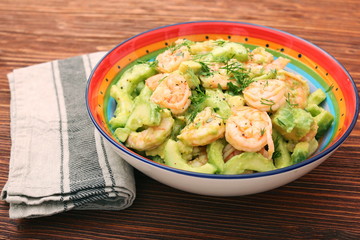 Avocado salad with shrimp and cucumber. Healthy lifestyle and eating concept.