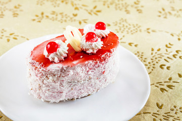 mini cake with cream and berries