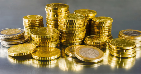 Business and finance concept: Save money for investment. Gold European coins.