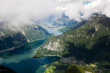 Naklejka na ściany i meble Freedom Flight. With a parachute over mountains and lakes.